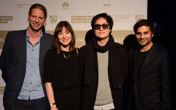 04_Emir Baigazin and his three producers.jpg